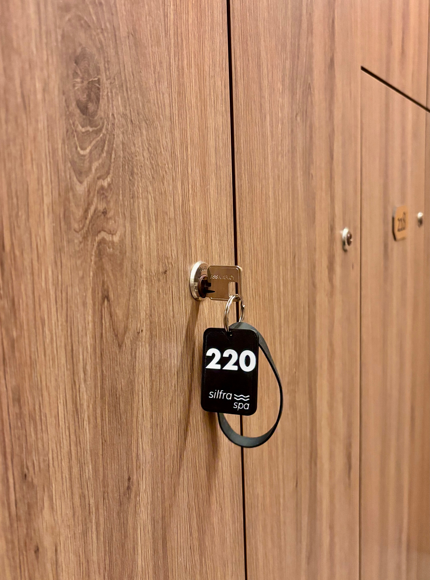 Silfra Spa NFC keychain #220 hanging from a locker door